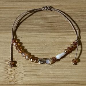 Adjustable bracelet with gold color charm