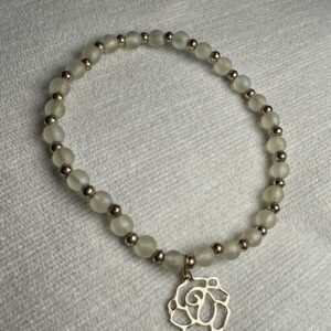 Handmade light yellow beads with flower charm