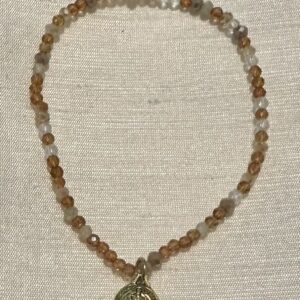 Handmade light orange with Rounded St Benedict charm
