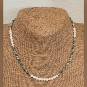 Green tones and pearl necklace